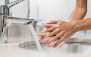 Washing hands with running water